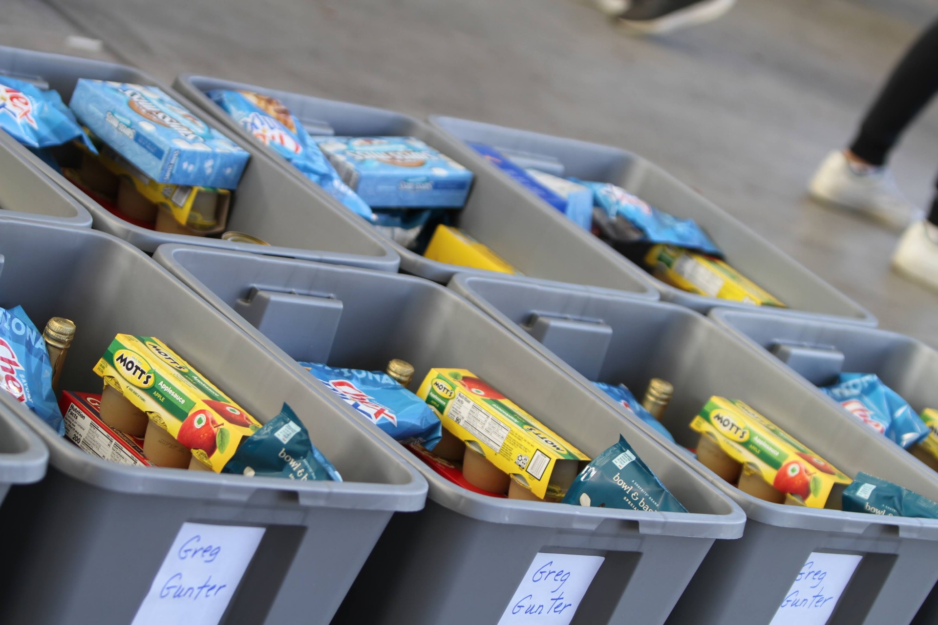 Al's Angels volunteers preparing donation bins for families in need
